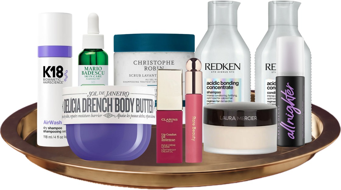 K18, Mario Badescu, Christophe Robin, Sol de Janeiro, Clarins, Rare Beauty, Redken, Laura Mercier and Urban Decay products on a tray